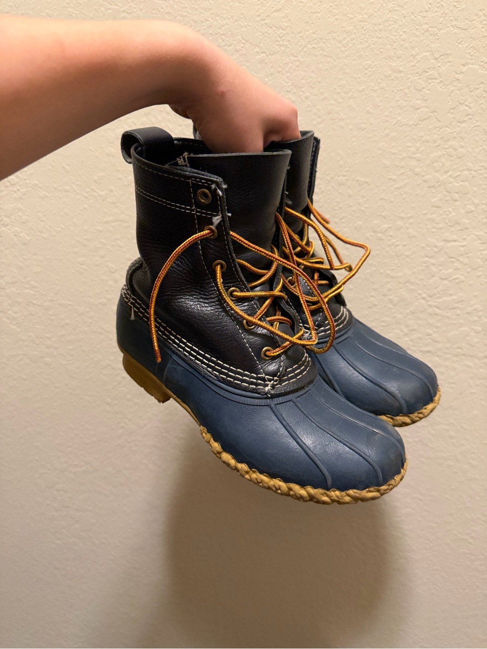 L.L. Bean navy blue and black leather duck boots with tan laces